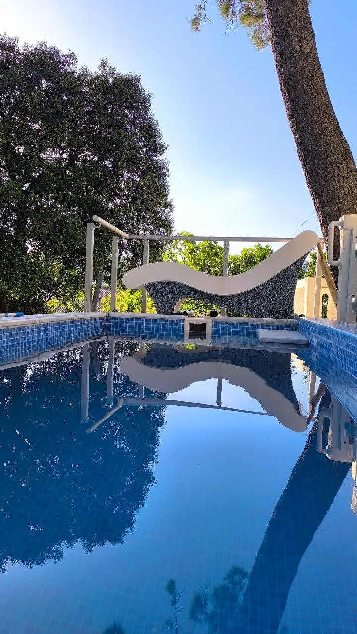 Private heated swimming pool at House in the Pines